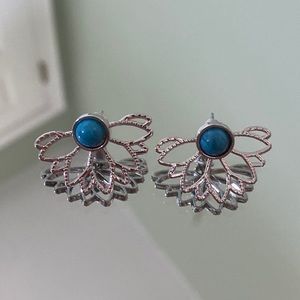Blue studs with a silver flower cuff jacket